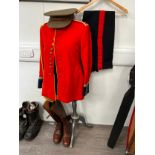 A British Army scarlet red tunic with 24th Regiment intrinsic King's Crown buttons, together with