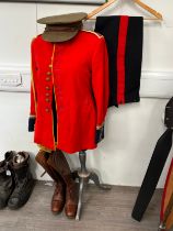 A British Army scarlet red tunic with 24th Regiment intrinsic King's Crown buttons, together with