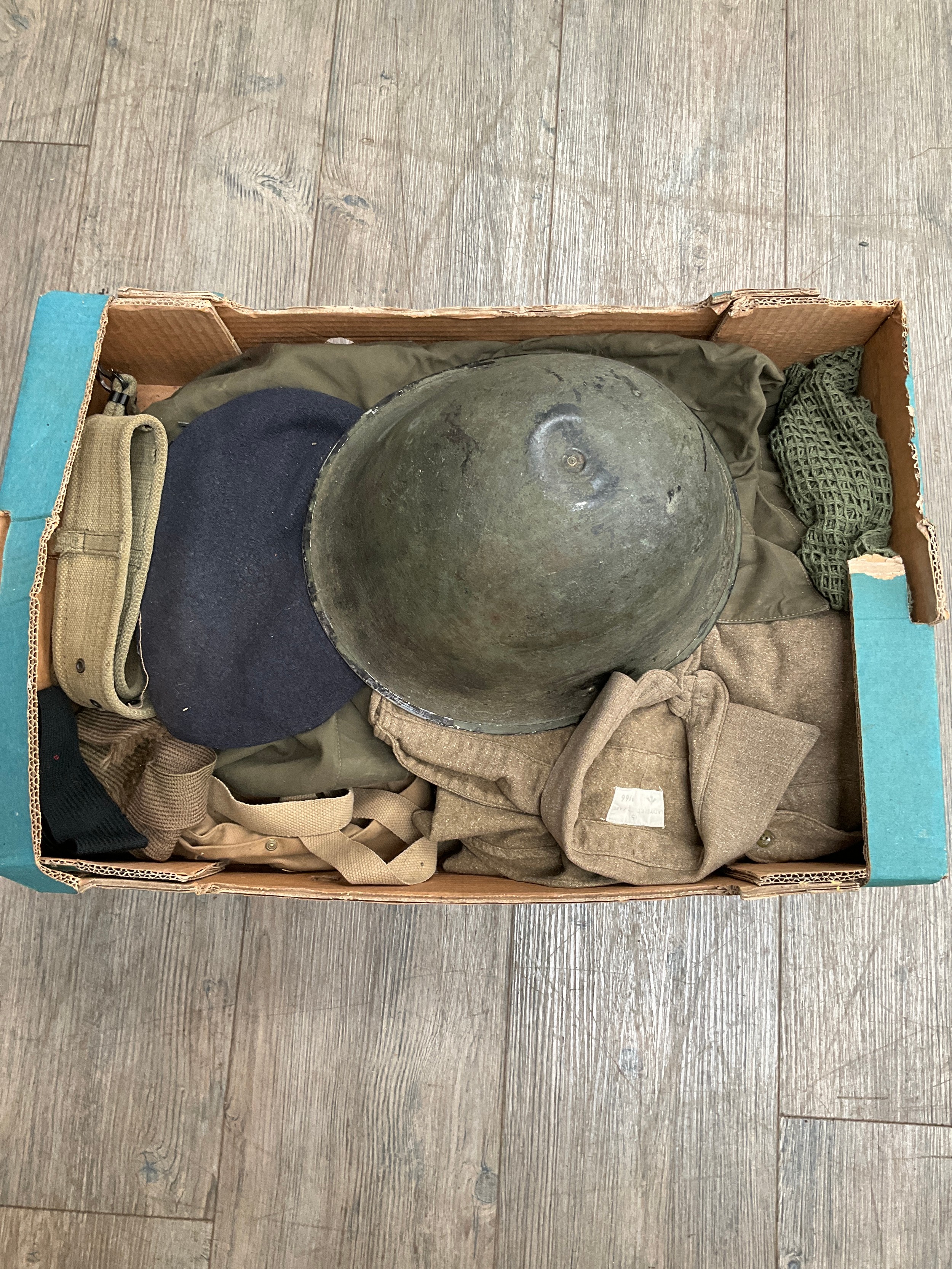 A box of post war British Army uniform, equipment, helmet etc