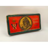 A South Africa 1900 gift tin with original chocolate contents, together with an embroidered silk