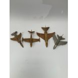 Four various models of 1950's and later stylised jet fighter aircraft including Jaguar