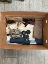 A box of RAF items including kit bag, side cap, and goggles etc