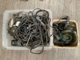 Two boxes of assorted headsets, microphones and wireless equipment dating from WWII and later