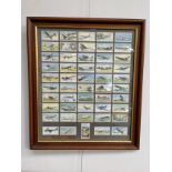A framed display of Player's 'International Air Liners 1936' cigarette cards