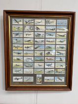 A framed display of Player's 'International Air Liners 1936' cigarette cards