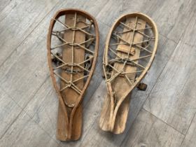 A pair of WWII snowshoes, dated 1941, some worm and damage