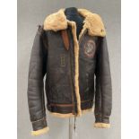 A WWII B3 sheepskin flying jacket by HLB Corp. New York, with artwork badge to front, size 46,