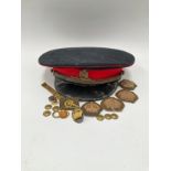 An early-mid 20th Century Royal Artillery officer's peaked cap, with cap badge, named J. Brame to