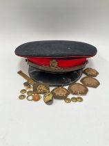 An early-mid 20th Century Royal Artillery officer's peaked cap, with cap badge, named J. Brame to