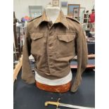 A WWII British 1940 pattern battledress blouse, size 12, serviceman was an RSS in the Royal Signals,
