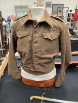 A WWII British 1940 pattern battledress blouse, size 12, serviceman was an RSS in the Royal Signals,