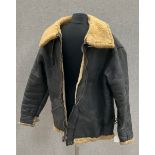 A WWII US B3 aircrew jacket, sheepskin and leather, with “TRIUMPH” lettering to reverse,