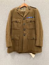 A British Army Chaplain's service jacket and trousers with insignia and medal bar