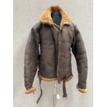 A WWII Irvin flying jacket, brown leather with sheepskin lining, Lightning zips, dated 1945 to