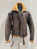 A WWII Irvin flying jacket, brown leather with sheepskin lining, Lightning zips, dated 1945 to