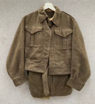 A WWII 1940 pattern Canadian battledress blouse dated 1944, together with a later pair of