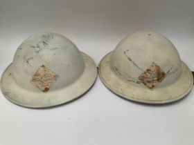Two WWII 1942 dated British Army helmets with liners, repainted