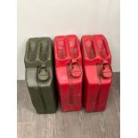 Three Jerry cans including 1945 diesel and 1950 petrol