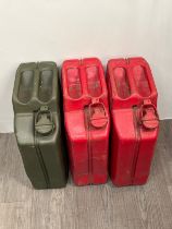 Three Jerry cans including 1945 diesel and 1950 petrol