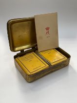 A WWI Christmas 1914 Princess Mary gift tin with gift card, tobacco and cigarette packets, the tin