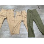 A box containing mixed British Army denim Battledress trousers and 1950 pattern trousers a/f