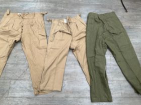 A box containing mixed British Army denim Battledress trousers and 1950 pattern trousers a/f