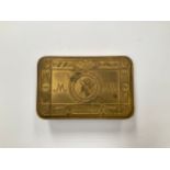 A WWI Christmas 1914 Princess Mary gift tin with contents consisting of bullet pencil and card