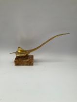 A stylised brass model of Concorde, upon a plinth base