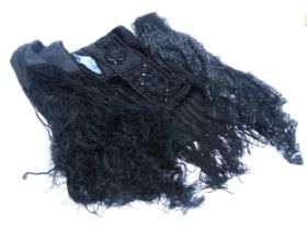 A box containing Victorian beadwork, two pieces of black lace, two black evening shawls, an early