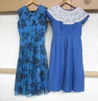 Two 1950's day dresses, one with an embossed felt effect foliate design, the other in plain blue