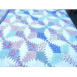 A hand stitched American style patchwork cotton throw