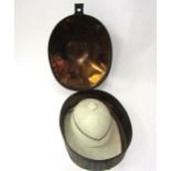 A Tress & C0 Ltd early 20th Century waterproof pith helmet contained in a painted finish tailor made