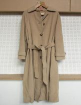 An Aquascutum late 1970's camel wool coat with tortoiseshell effect buttons, single breasted, cuff