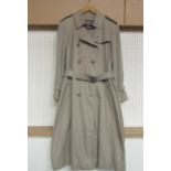 A Burberry's, London, women's double breasted raincoat