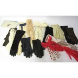 A box containing vintage fashion gloves in various colours, styles and fabrics, leather and suede