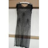 A vintage 1920's black sheer beaded lace tabard dress, no under skirt