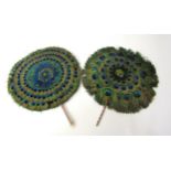 A pair of circular disc Peacock feather fans