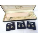 A set of Pompadour Pearls Aurora Borealis crystal necklace and three pairs of marcasite clip-on