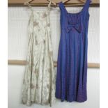 Two 1950's full length evening gowns, pale gold with rust, olive and cream trailing foliate