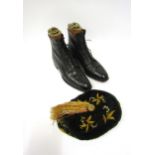 A pair of Victorian black leather lace-up ankle boots with twine leather laces together with a