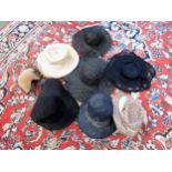Two boxes containing ladies mid century fashion hats in various colours, styles and materials