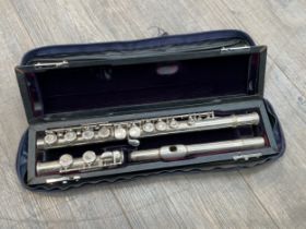 A Trevor James of London 10ix flute, cased and with cover