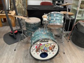 A 1970's Ludwig blue and olive badge four piece drum kit in blue oyster bowling ball finish,