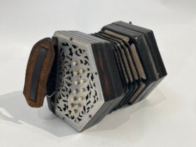 An early-mid 20th Century concertina, pierced metal ends