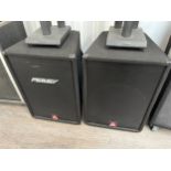 A pair of Peavey Eurosys 3 PA speakers with covers