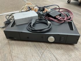 A Rega Elicit amplifier with Arcam rDAC digital to analog converter and cabling COLLECTOR'S