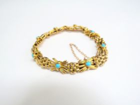 A 9ct gold fancy link bracelet set with eight cabochon turquoise stones, 18cm long, 16.1g