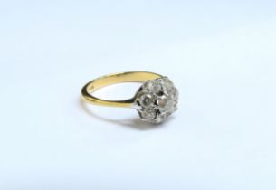 A diamond cluster ring, stamped 18ct. Size N/O, 2.9g