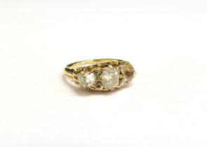 A late 19th Century diamond ring, three old cut diamond's spaced by two small diamonds, 2ct approx