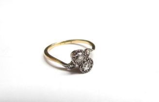 A late 19th Century old cut diamond cross over ring, unmarked. Size K, 1.9g